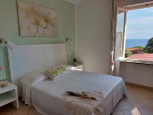 Postel nebo postele na pokoji v ubytování Hotel Holiday Bambù