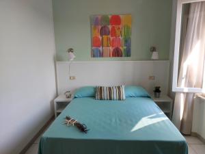 Postel nebo postele na pokoji v ubytování Hotel Holiday Bambù