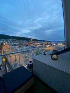 a balcony with a view of a parking lot at Penthouse with private balcony in the city centre of Bergen in Bergen