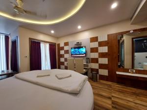 Televiisor ja/või meelelahutuskeskus majutusasutuses New Gitanjali Hotel, New Digha