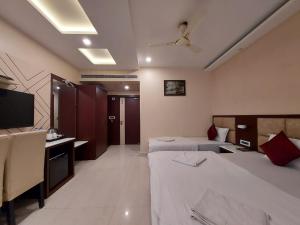 Voodi või voodid majutusasutuse New Gitanjali Hotel, New Digha toas