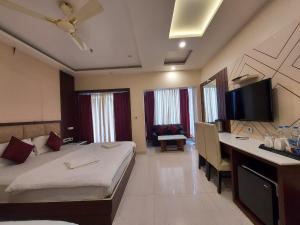 Voodi või voodid majutusasutuse New Gitanjali Hotel, New Digha toas