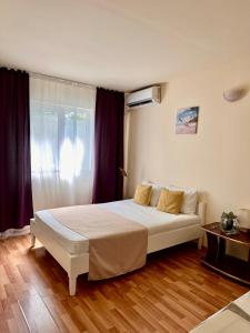 Postel nebo postele na pokoji v ubytování Casa Tin Ultracentral Costinesti