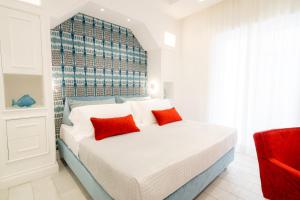 Postel nebo postele na pokoji v ubytování L'INCANTO DI CIOFFI ROOMS