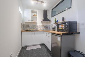 Η κουζίνα ή μικρή κουζίνα στο Terrazza Moriani - Charmant appartement à 500m de la mer