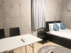 Rúm í herbergi á Laffitte Tokyo