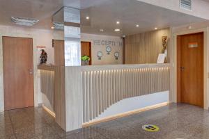 a lobby with a reception desk in a building at Paraiso Theopolis - All Inclusive in Obzor +37 photos