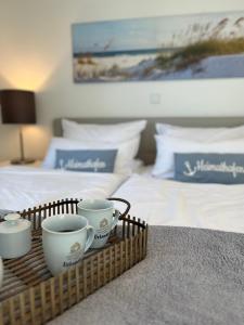 Ein Bett oder Betten in einem Zimmer der Unterkunft Südkap C-01