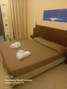 Posteľ alebo postele v izbe v ubytovaní Hotel Villa Ionia