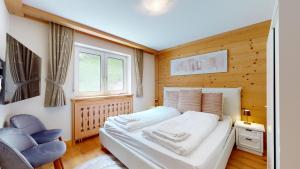 Postel nebo postele na pokoji v ubytování Cosy apartment surrounded by nature in Varen - Salgesch region