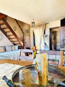 a living room with a table and a couch at Villa La dame blanche in Skala Potamias