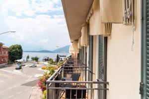 a balcony of a building with a view of a street at Hotel del Conte in Laveno