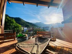a balcony with a table and a view of a mountain at Villa La dame blanche in Skala Potamias