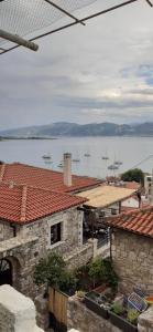 a view of a large body of water with boats at Stone Clock's House in Nafpaktos