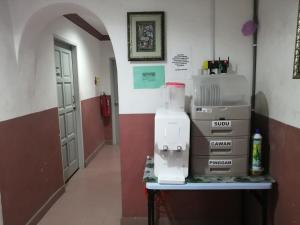 a room with a table with boxes on it at Mi Hotel 2 Dungun in Dungun