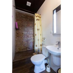 a bathroom with a toilet and a sink at Studio apartments in the city center in Kharkiv
