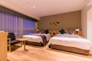 Una cama o camas en una habitación de Spa & Hotel Suishun Matsuiyamate
