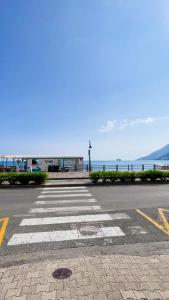 an empty parking lot with the ocean in the background at Donna Elena House in Maiori