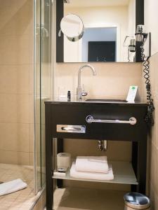 Um banheiro em Hotel Victoria