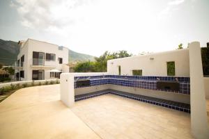 a house with blue tiles on the side of it at Scopello - Luxury Residence con piscina - 5 minuti dal mare in Castellammare del Golfo