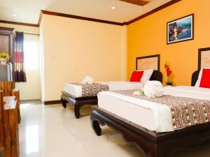 Letto o letti in una camera di AIRBEST Explore Chiang Rai Hotel