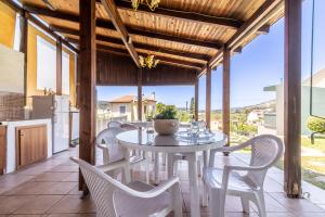 a dining room with a table and chairs on a patio at House with Pool & Garden for Families & Friends 1 in Heraklio Town