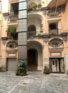 a building with stairs and balconies on it at Lucullo's Rooftop in Naples