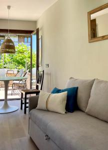 a living room with a couch and a table at Calendula Hotel in Sant Feliu de Guixols