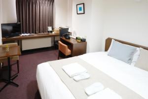 Vuode tai vuoteita majoituspaikassa Pod Select Hotel Shinjuku