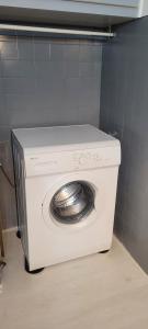 a white washing machine in a small room at Nice Centre, Superbe Studio Proche Mer in Nice