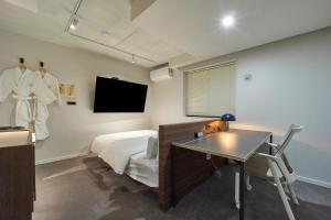TV a/nebo společenská místnost v ubytování Aank Hotel Busan Nampo