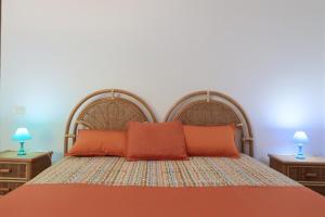 A bed or beds in a room at Trullo - Cantoru by LoveSud