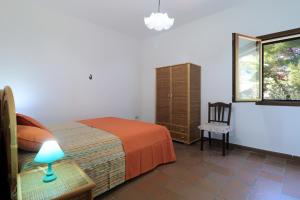 A bed or beds in a room at Trullo - Cantoru by LoveSud