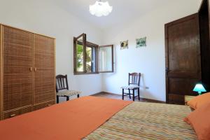 A bed or beds in a room at Trullo - Cantoru by LoveSud