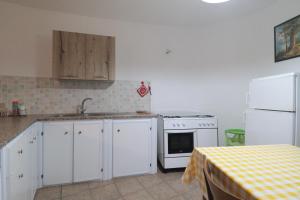 A kitchen or kitchenette at Trullo - Cantoru by LoveSud