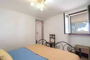 A bed or beds in a room at Trullo - Cantoru by LoveSud
