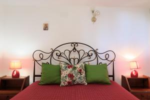 A bed or beds in a room at Trullo - Cantoru by LoveSud