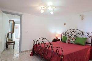 A bed or beds in a room at Trullo - Cantoru by LoveSud
