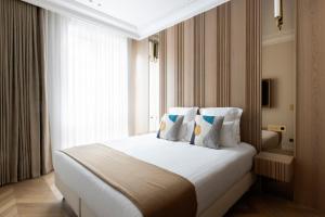 Postelja oz. postelje v sobi nastanitve HIGHSTAY - Luxury Serviced Apartments - Le Marais District