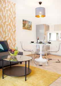 a living room with a couch and a table at FEEL HOME Superior-FREE PARKING-BALCONY-AC-Elevator in Budapest