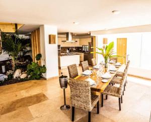 a dining room with a table and chairs at 2029 - Villa Camino Real in Santa Cruz Huatulco