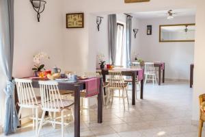 a dining room with tables and chairs at Dubasa B&B in Vantačići +59 photos
