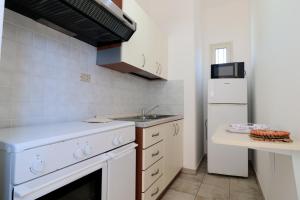 A kitchen or kitchenette at Trullo - Cantoru by LoveSud