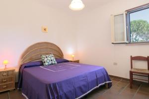 A bed or beds in a room at Trullo - Cantoru by LoveSud