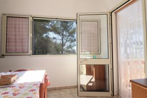 A bed or beds in a room at Trullo - Cantoru by LoveSud