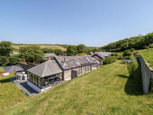 an overhead view of a house on a grassy hill at The Old Stables in Newquay