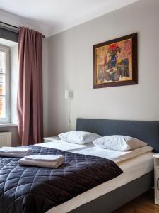 Posteľ alebo postele v izbe v ubytovaní Apartments Rynek Glowny
