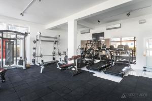 a gym with several treadmills and other equipment at Sunny, big pool, garden-roof terrace view Cornervilla on area Kyrenia-Bahceli North-Cyprus in Bahçeli