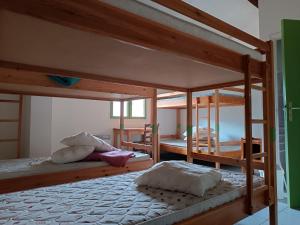 two bunk beds in a room with twothirds of the room at Auberge De Calendal in Aiglun