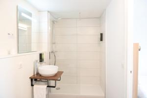 a bathroom with a sink and a shower at Hôtel Inn Design La Rochelle in La Rochelle +52 photos